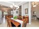 Inviting dining area adjacent to the kitchen and living room, featuring a stylish chandelier at 7816 Glowing Peak St, Las Vegas, NV 89131