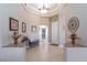 Elegant foyer with tray ceiling, decorative tile flooring, and tasteful decor elements at 7816 Glowing Peak St, Las Vegas, NV 89131