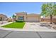 Charming single-story home featuring a two-car garage, manicured lawn, and desert-friendly landscaping at 7816 Glowing Peak St, Las Vegas, NV 89131