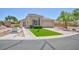 Charming single-story home with well-maintained landscaping and a welcoming entrance on a sunny day at 7816 Glowing Peak St, Las Vegas, NV 89131