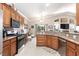 Spacious kitchen with modern appliances, granite countertops, and an open layout for entertaining at 7816 Glowing Peak St, Las Vegas, NV 89131