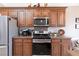 Well-equipped kitchen boasts stainless steel appliances, and ample counter space at 7816 Glowing Peak St, Las Vegas, NV 89131