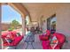Inviting covered patio with comfortable seating, perfect for outdoor relaxation and entertaining guests at 7816 Glowing Peak St, Las Vegas, NV 89131