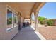 Spacious covered patio with ample seating area and outdoor grill, ideal for backyard gatherings at 7816 Glowing Peak St, Las Vegas, NV 89131