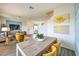 Open concept living space featuring a modern dining area that flows seamlessly into a beautifully designed living room at 7935 Pandora Sky St # 3822, Las Vegas, NV 89084