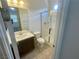 A bathroom showcasing vanity, toilet and glass-enclosed shower providing modern comfort at 8550 Lost Pony St, Las Vegas, NV 89148