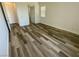 Spacious bedroom with wood-look floors and plenty of natural light at 8550 Lost Pony St, Las Vegas, NV 89148
