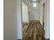 Bright hallway features hard surface flooring and leads to other rooms at 8550 Lost Pony St, Las Vegas, NV 89148