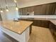Kitchen featuring granite countertops, tile backsplash, stainless steel range, and wood cabinets at 8550 Lost Pony St, Las Vegas, NV 89148