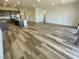 Spacious living area open to kitchen, featuring hard surface flooring, and recessed lighting at 8550 Lost Pony St, Las Vegas, NV 89148