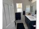 This modern bathroom features dual sinks, marble countertops, and updated fixtures at 871 Buol Rd, Pahrump, NV 89048