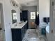 Modern bathroom with dual sinks, standalone tub, and marble-look flooring at 871 Buol Rd, Pahrump, NV 89048
