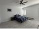 This large bedroom features a ceiling fan and neutral paint at 871 Buol Rd, Pahrump, NV 89048