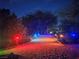 Gravel driveway with colored lights on pathway leading to a property entrance at 871 Buol Rd, Pahrump, NV 89048