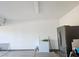 Large garage with freezer, refrigerator, and access to other parts of the home at 871 Buol Rd, Pahrump, NV 89048