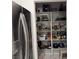 Spacious pantry with shelves stocked full of food and cooking supplies at 871 Buol Rd, Pahrump, NV 89048