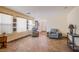 Open living room with great natural light and a neutral color palette at 9022 Sosa Creek Ave, Las Vegas, NV 89149