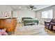 A well lit bedroom features wood-look flooring and neutral walls at 9340 W Washburn Rd, Las Vegas, NV 89149
