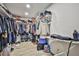 Walk-in closet features ample hanging space, shelving, and an ironing board at 9340 W Washburn Rd, Las Vegas, NV 89149