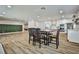 Open dining and kitchen area boasts modern finishes and spacious layout, perfect for entertaining at 9340 W Washburn Rd, Las Vegas, NV 89149