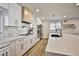 Updated kitchen boasting quartz countertops, modern cabinetry, and stainless steel appliances at 9340 W Washburn Rd, Las Vegas, NV 89149
