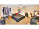 Bedroom boasts a ceiling fan, closet, and neutral colored walls and carpet at 9879 Jazzy June St, Las Vegas, NV 89183