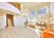 Bright living room featuring a fireplace, large windows, and an open floor plan at 9879 Jazzy June St, Las Vegas, NV 89183
