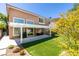 The backyard features artificial turf, a covered patio, and is ideal for outdoor activities at 1013 Corsica Ln, Las Vegas, NV 89144