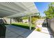 This backyard features a covered patio, artificial turf, and a well-maintained landscape at 1013 Corsica Ln, Las Vegas, NV 89144