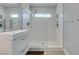 Bathroom featuring a modern vanity, mirror, and glass-enclosed shower at 1013 Corsica Ln, Las Vegas, NV 89144