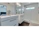 Bathroom featuring a modern vanity, mirror, and glass-enclosed shower at 1013 Corsica Ln, Las Vegas, NV 89144