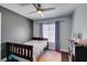 Cozy bedroom featuring a ceiling fan, colorful rug, and a twin bed at 1013 Corsica Ln, Las Vegas, NV 89144
