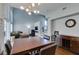 Open-concept dining area featuring modern lighting, high ceilings, and seamless transition to the living space and staircase at 1013 Corsica Ln, Las Vegas, NV 89144
