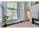 Sunlit entryway with high ceilings, large windows, and a glimpse of the front door at 1013 Corsica Ln, Las Vegas, NV 89144