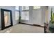 Entryway featuring high ceilings, large windows, and a decorative mirror at 1013 Corsica Ln, Las Vegas, NV 89144