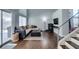 Open living room with a sectional sofa, modern fireplace, and staircase at 1013 Corsica Ln, Las Vegas, NV 89144