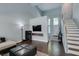 Open living room showcases tall ceilings, modern fireplace, and staircase at 1013 Corsica Ln, Las Vegas, NV 89144