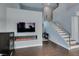 Modern living room complete with contemporary fireplace and staircase at 1013 Corsica Ln, Las Vegas, NV 89144