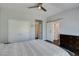 Spacious main bedroom with modern lighting, a large window, and hardwood floors at 1013 Corsica Ln, Las Vegas, NV 89144
