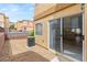 Exterior shot of a stone backyard area, with sliding glass door and AC unit at 10437 Coyote Cub Ave, Las Vegas, NV 89129
