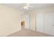 Neutral bedroom with closet and entry to office area with plenty of natural light at 10437 Coyote Cub Ave, Las Vegas, NV 89129