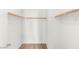 This walk-in closet has rods, shelves, and neutral carpeting at 10437 Coyote Cub Ave, Las Vegas, NV 89129