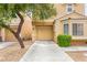 A view of a two-story house with a private driveway and attached one-car garage at 10437 Coyote Cub Ave, Las Vegas, NV 89129