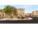 Inviting two-story home featuring a well-manicured lawn and a charming architectural design at 10437 Coyote Cub Ave, Las Vegas, NV 89129