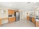 Bright kitchen featuring stainless steel appliances, light wood cabinets, and recessed lighting at 10437 Coyote Cub Ave, Las Vegas, NV 89129