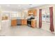 Well-lit kitchen with stainless steel appliances, tile flooring, and backyard access at 10437 Coyote Cub Ave, Las Vegas, NV 89129