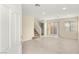 Bright living room featuring tile floors, recessed lighting, and stairs leading to the second floor at 10437 Coyote Cub Ave, Las Vegas, NV 89129