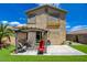 Backyard featuring artificial grass, a patio, a pergola and a two-story house at 10645 Lace Vine Arbor Ave, Las Vegas, NV 89144