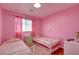 Bright bedroom with two twin beds, a built-in closet, and a desk space at 10645 Lace Vine Arbor Ave, Las Vegas, NV 89144