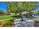 Community playground featuring colorful play equipment and manicured landscaping at 10645 Lace Vine Arbor Ave, Las Vegas, NV 89144